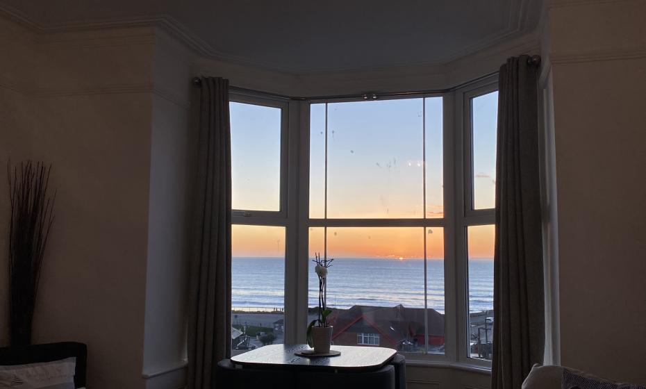 Stunning sunset beach views from one of Seablue View's windows... sit and relax watching the sun go down!