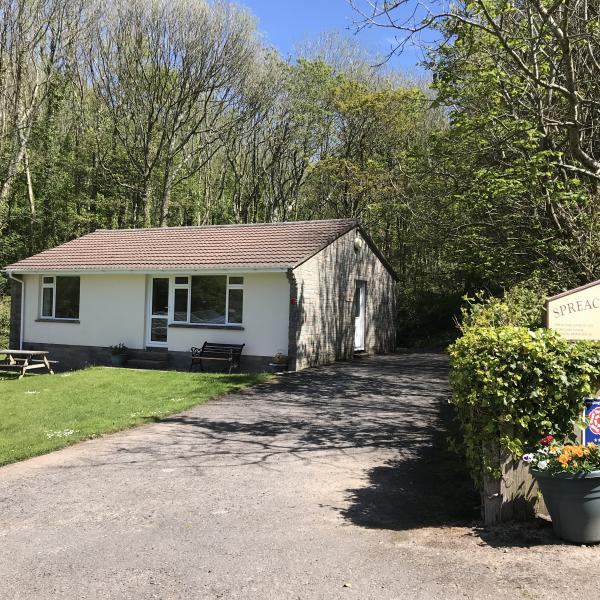 Azalea Cottage, backed by woodland